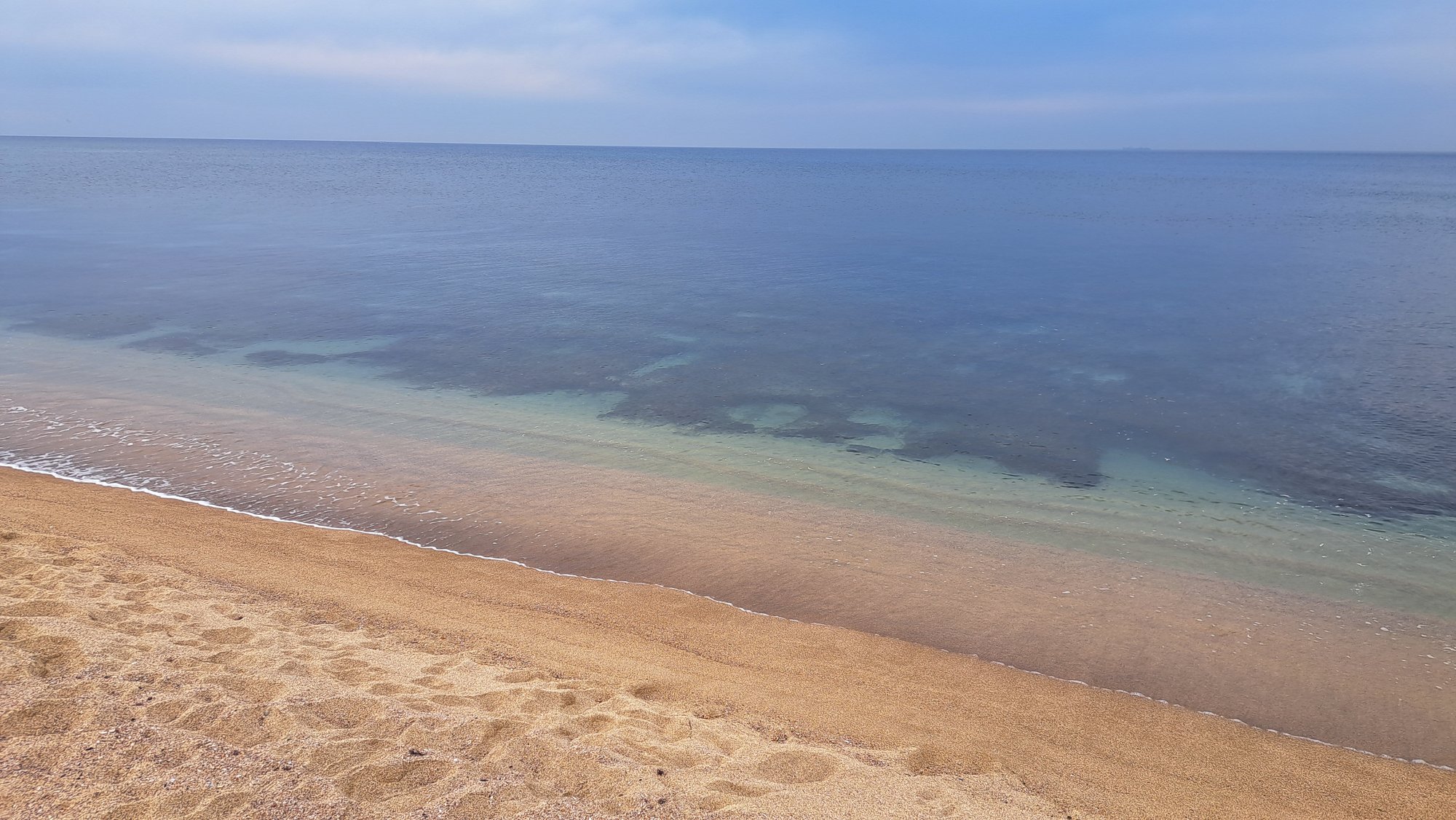 A calm sea meeting the shore